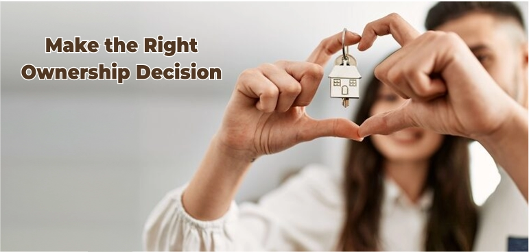 Married couple holding a house key together, illustrating joint home ownership in the UK